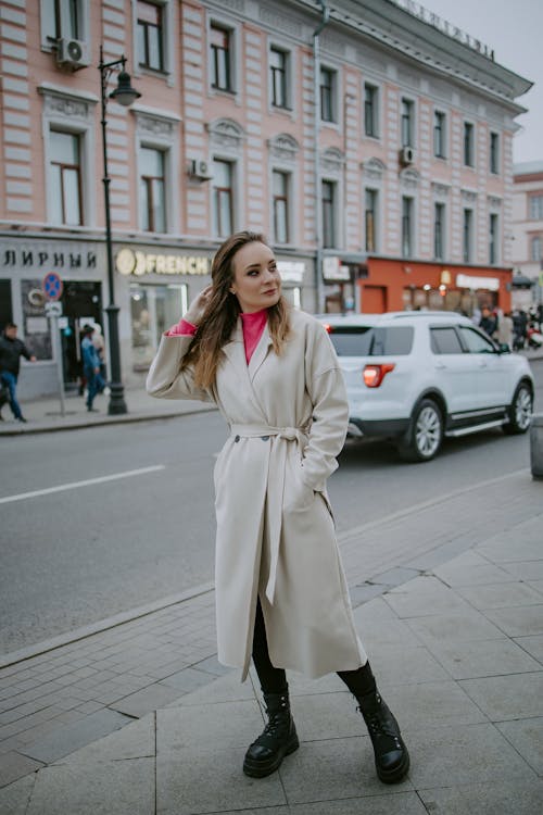 Woman in Coat and Boots in City