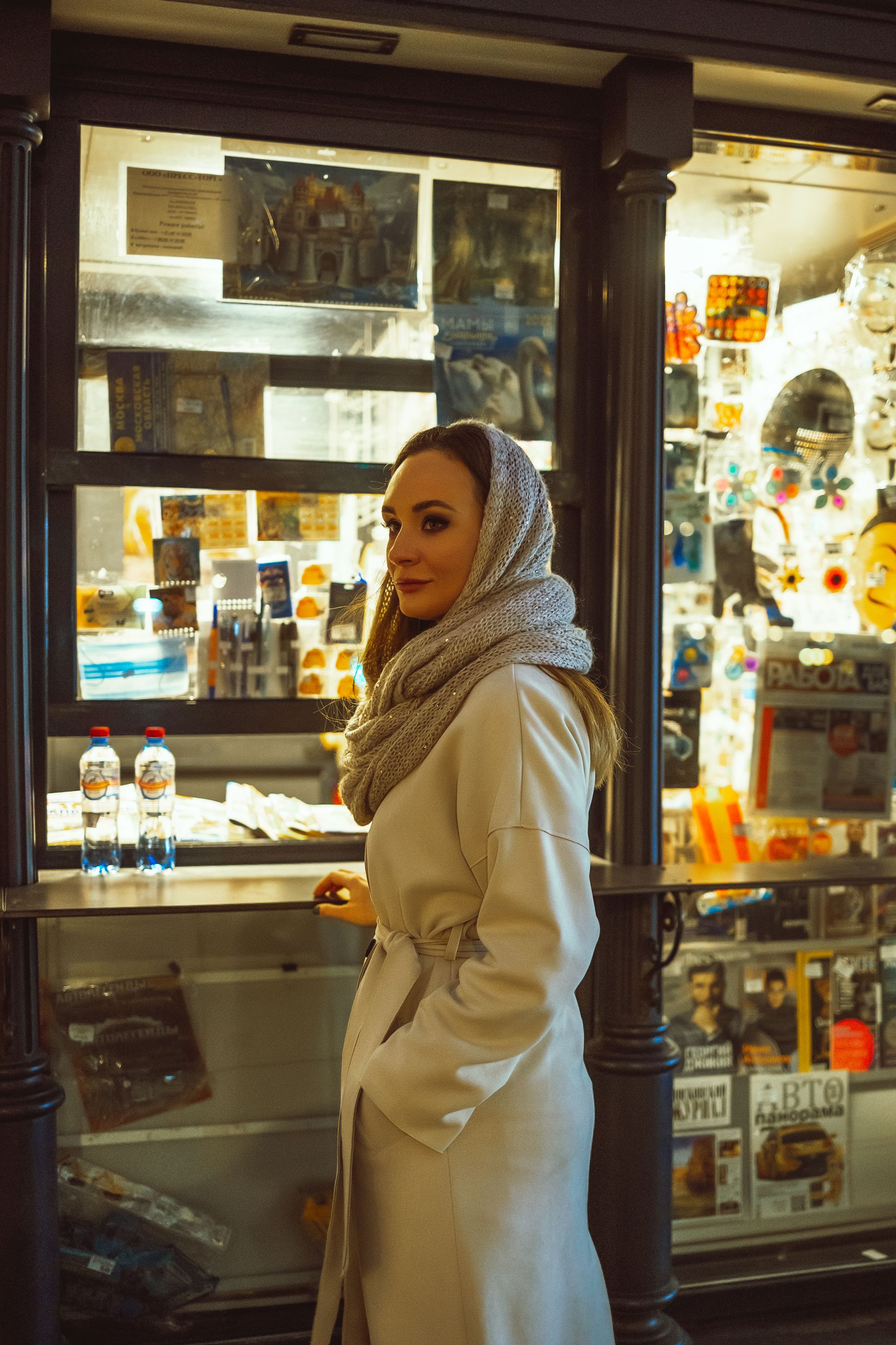 A Woman in Front of a Newsstand · Free Stock Photo