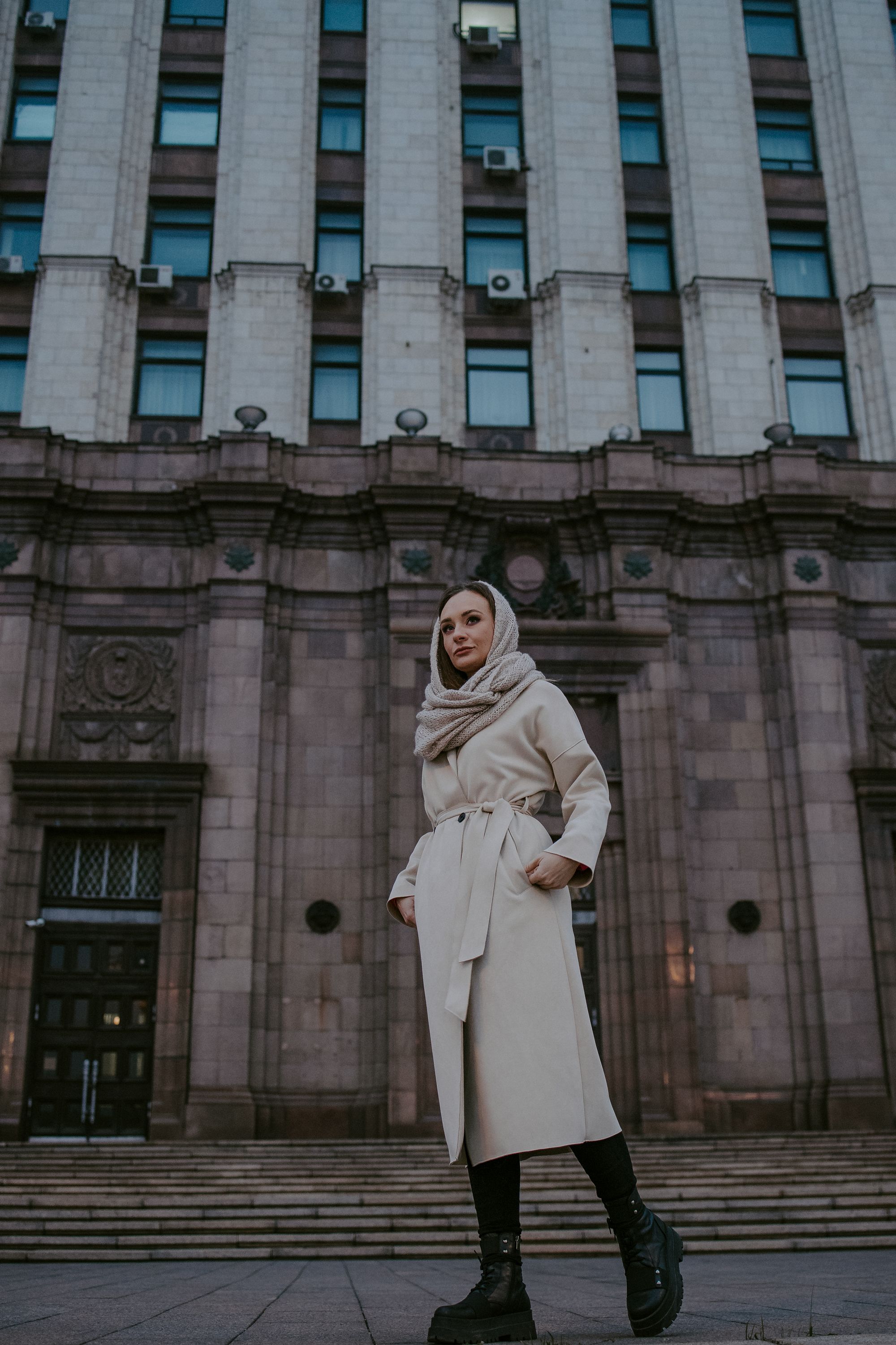 Woman in Shawl and Coat Standing near Building · Free Stock Photo