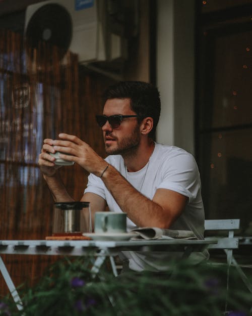 Man with Cup at Cafe