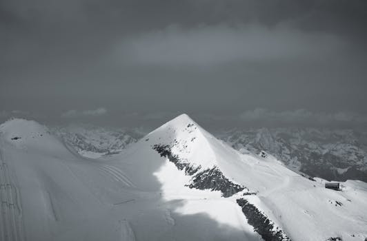 Breathtaking view of snow-covered peaks in Hintertux, Tirol, Austria, showcasing nature's beauty.