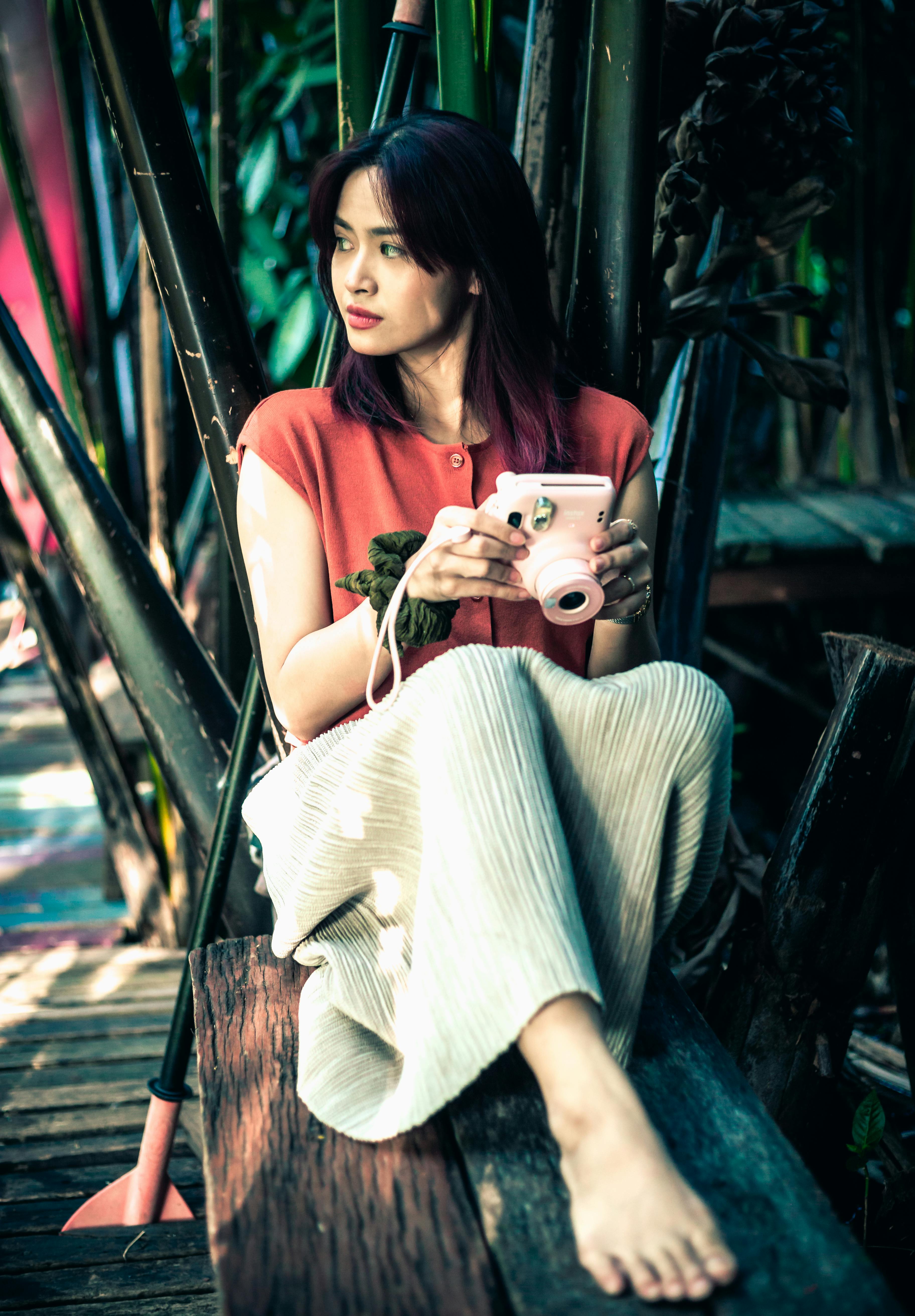 Woman Sitting with Camera · Free Stock Photo