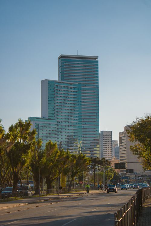 Free A vibrant urban scene showcasing modern skyscrapers under a clear blue sky. Stock Photo