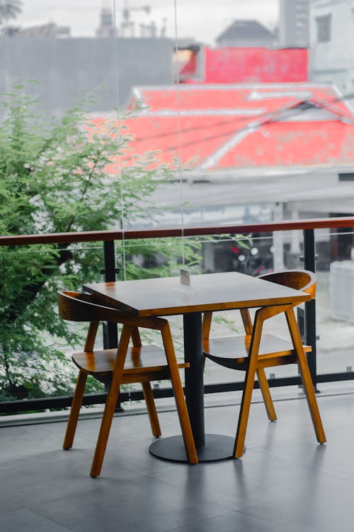 Empty Chairs and Table on Terrace