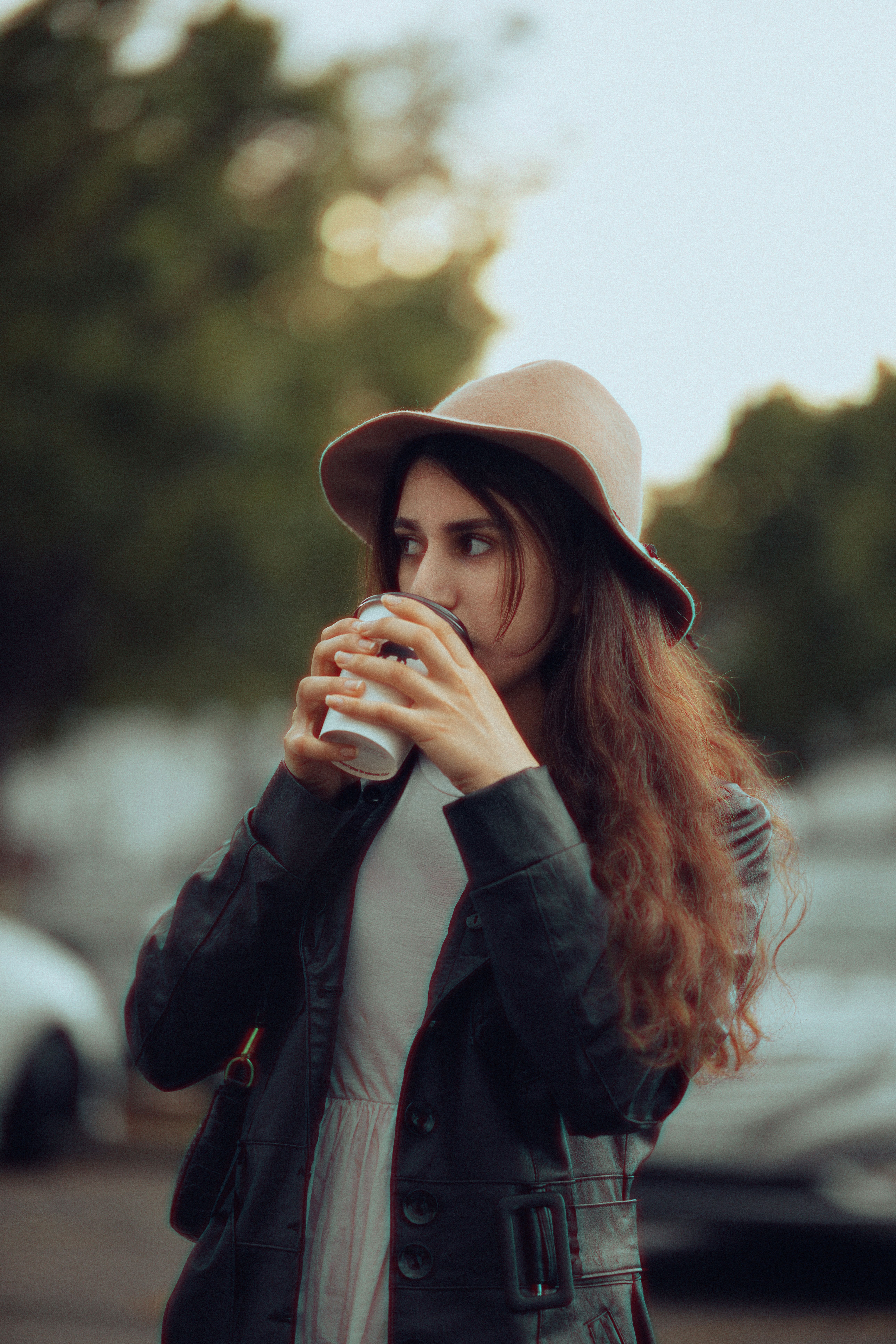 Woman in Hat and Jacket Drinking from Cup · Free Stock Photo