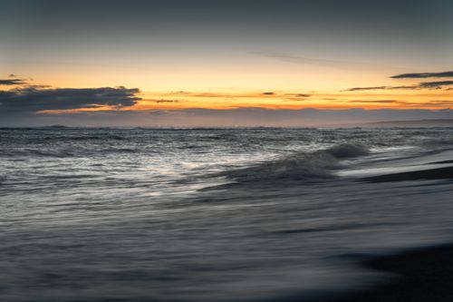 Free Peaceful sunset scene at Þorlákshöfn beach in Iceland, capturing scenic waves. Stock Photo