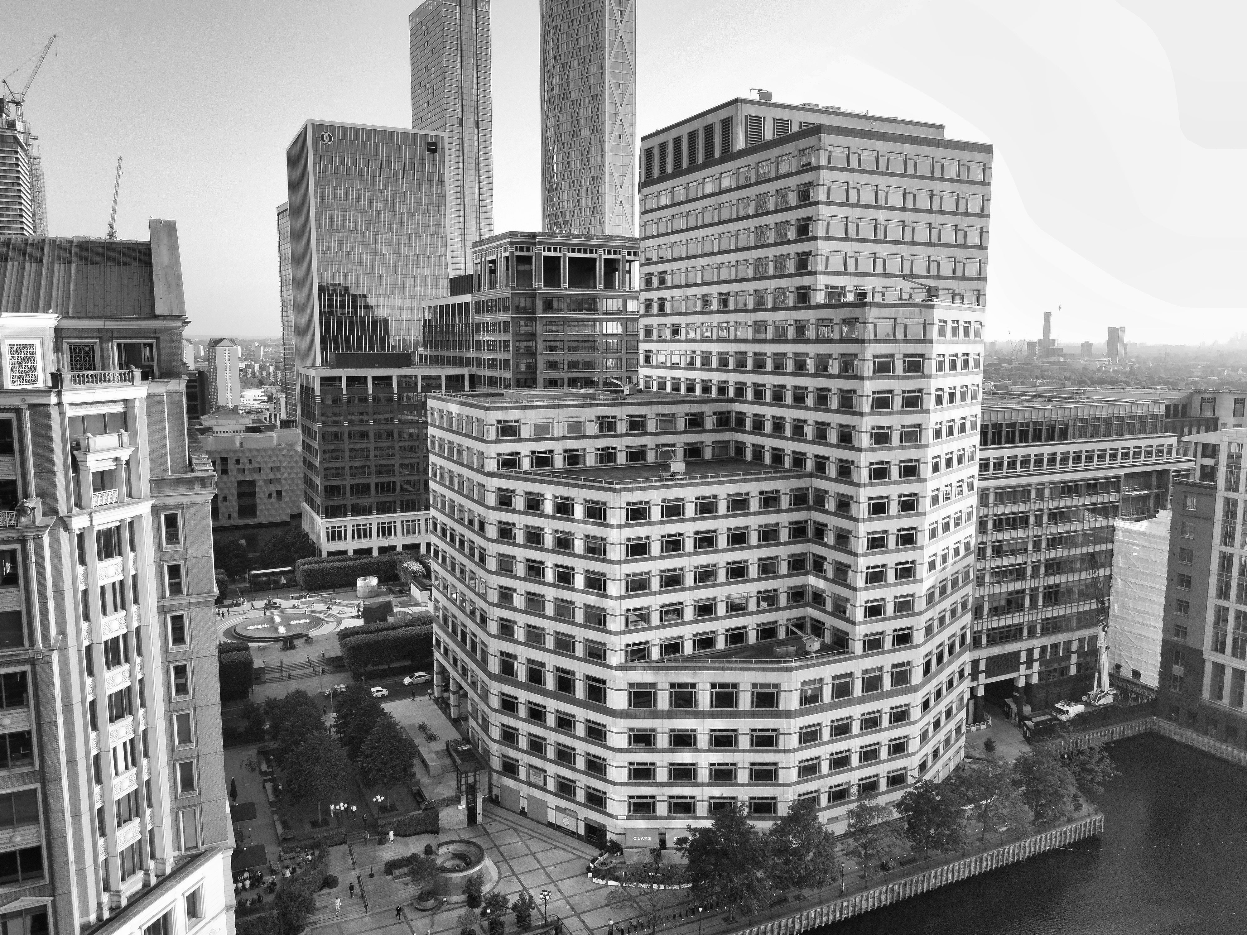 Stunning aerial view of Canary Wharf's modern architecture in black and white.
