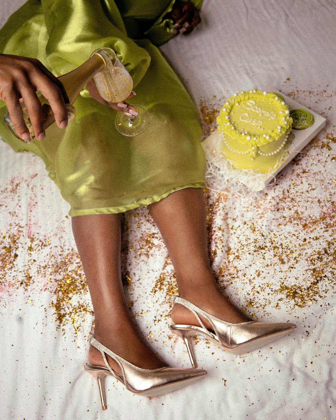 A festive scene with cake, champagne, and an elegant dress emphasizing luxury and celebration.