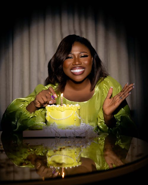 Smiling Woman Lighting Wedding Cake
