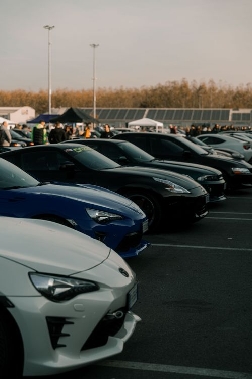 Free Lineup of sports cars at an outdoor event in Cremona, Italy, showcasing automotive diversity. Stock Photo