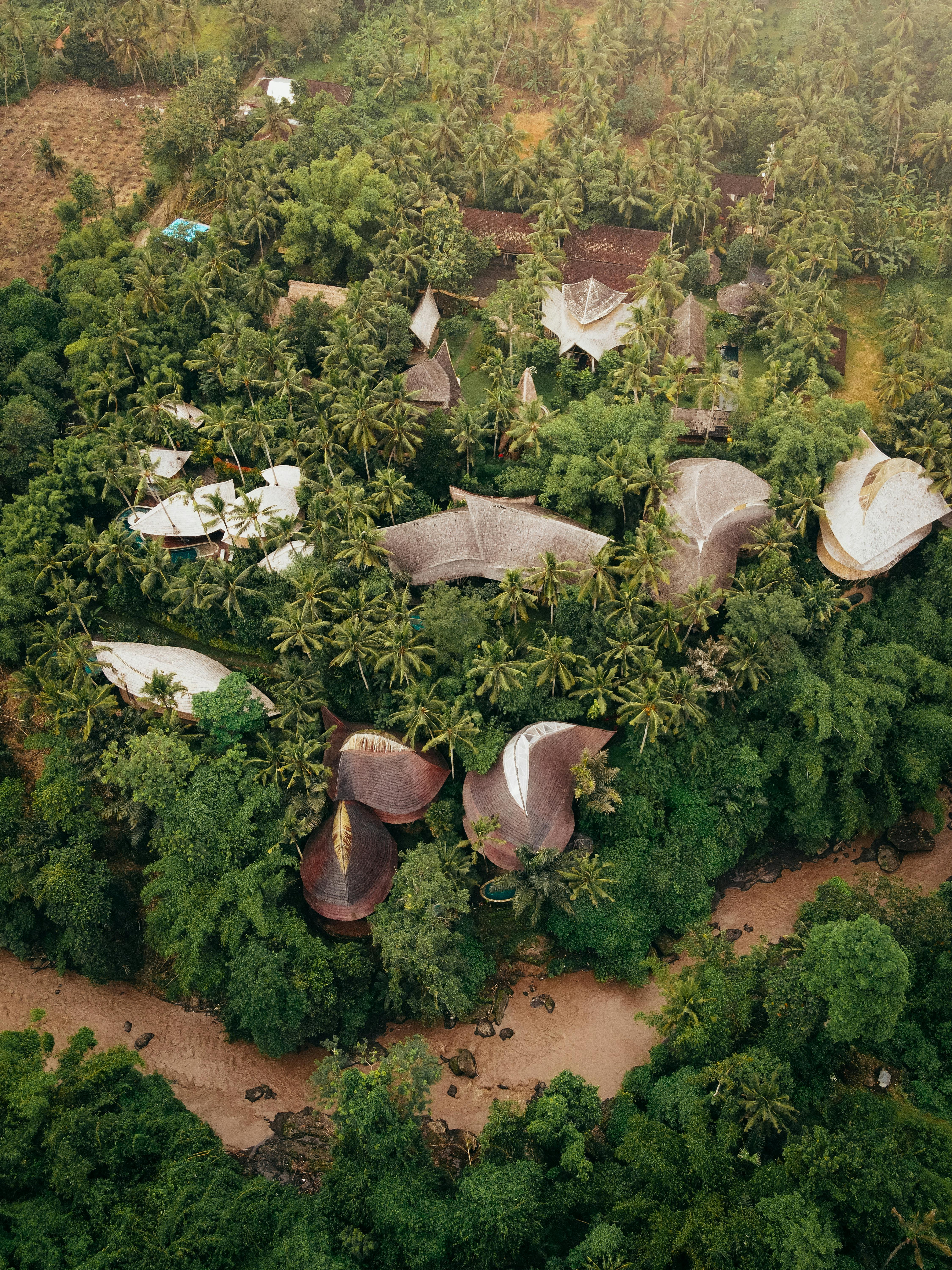 A captivating aerial view of unique infrastructure nestled within Bali's lush jungle.
