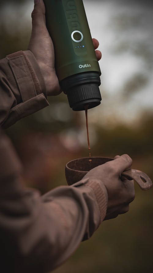 Hands Pouring Tea