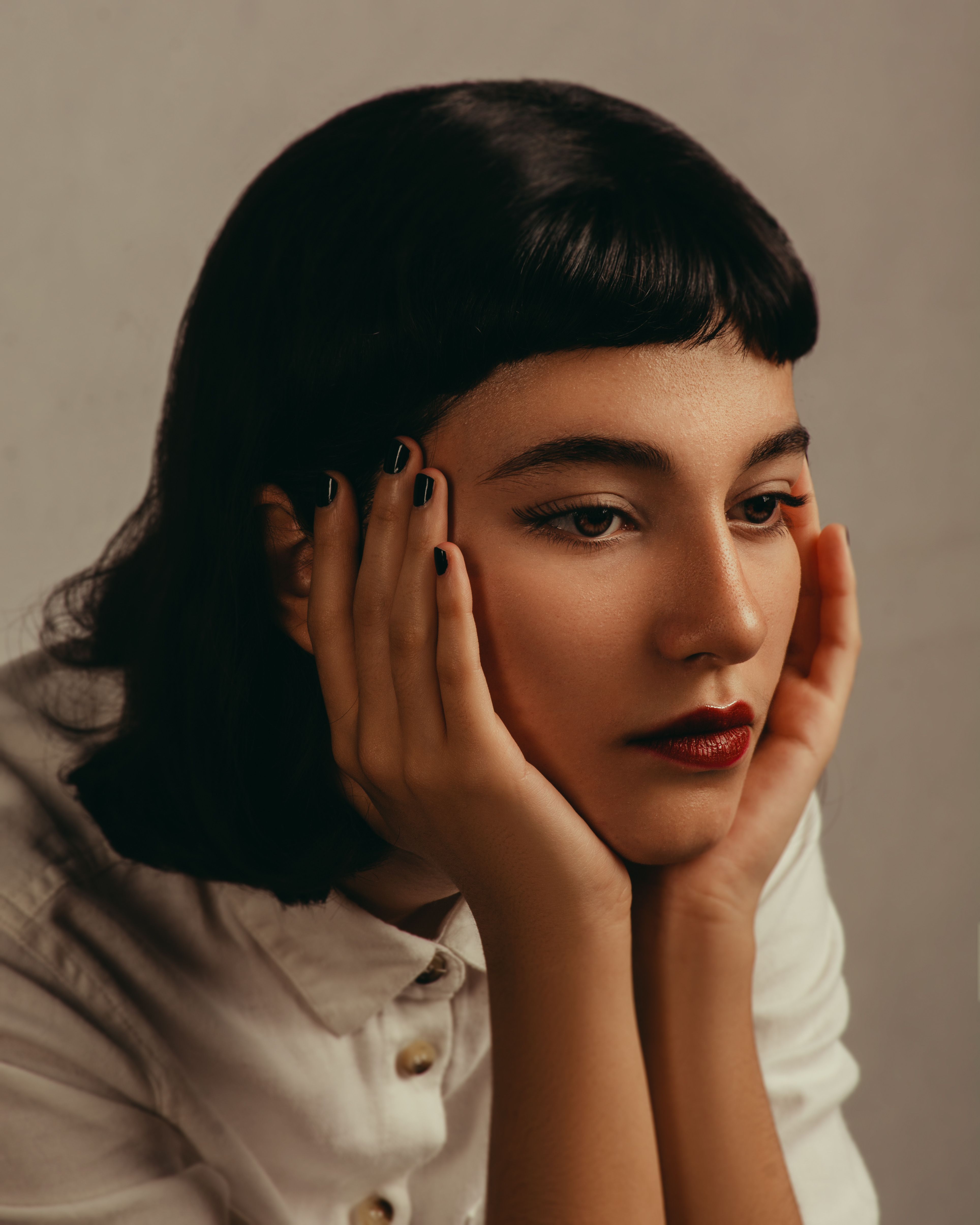 Woman with Hands on Cheeks · Free Stock Photo