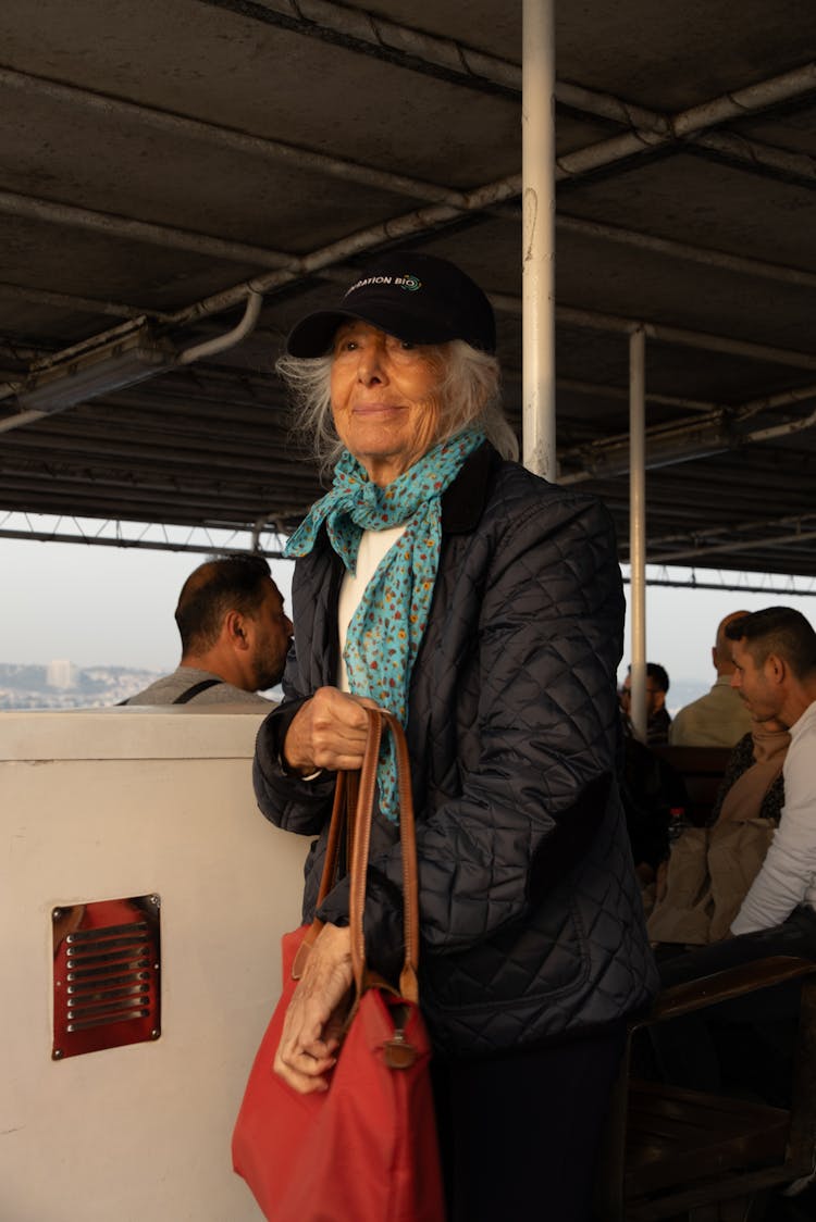 Elderly Woman With Red Purse