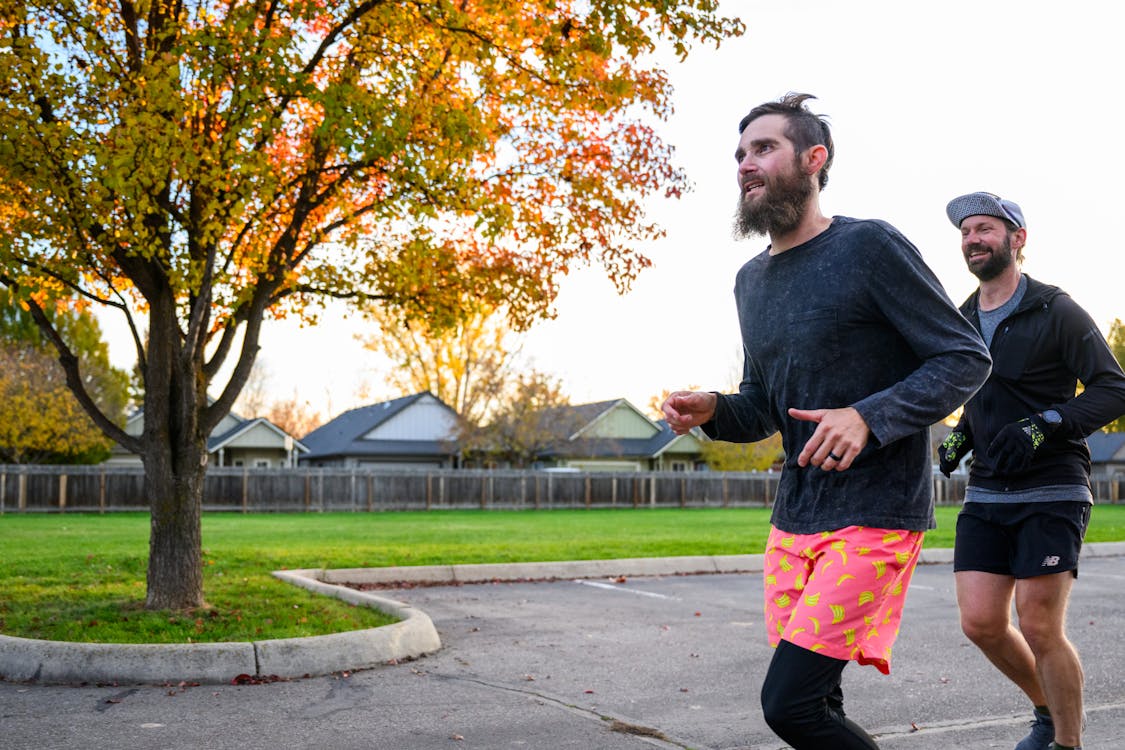 Sporty man jogging in a park stock photo