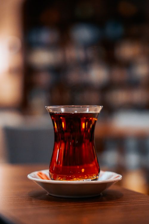 Free Close-up of Turkish tea served in classic tulip glass indoors, warm ambiance. Stock Photo