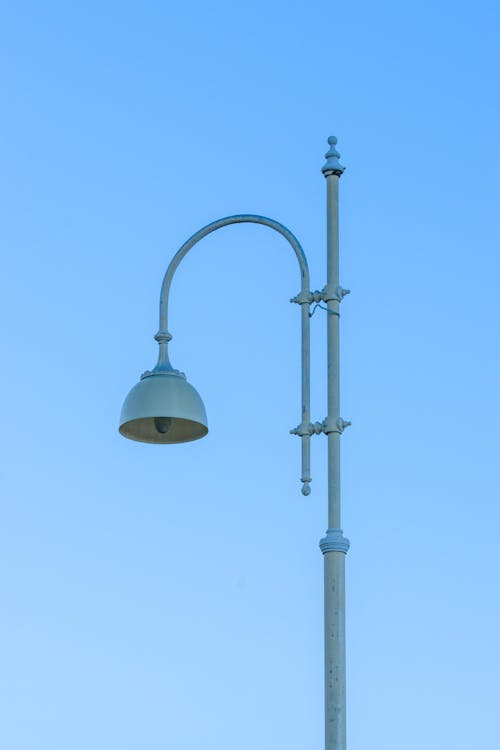 Decorative Street Lamp in Retro Style on Blue Sky Background