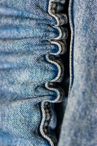 Close-up of a washed denim waistband — Diana ✨ on Pexels
