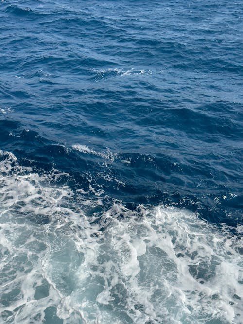 Foamy Water on the Surface of the Turquoise Sea