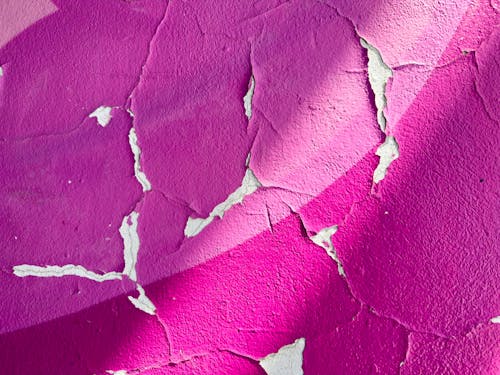 Cracks on Purple Paint on Wall