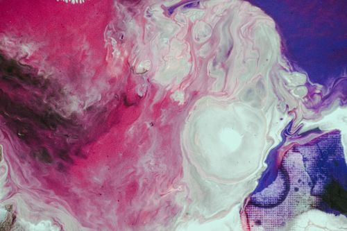 Free Colorful abstract acrylic pour painting with swirling pink and purple patterns. Stock Photo