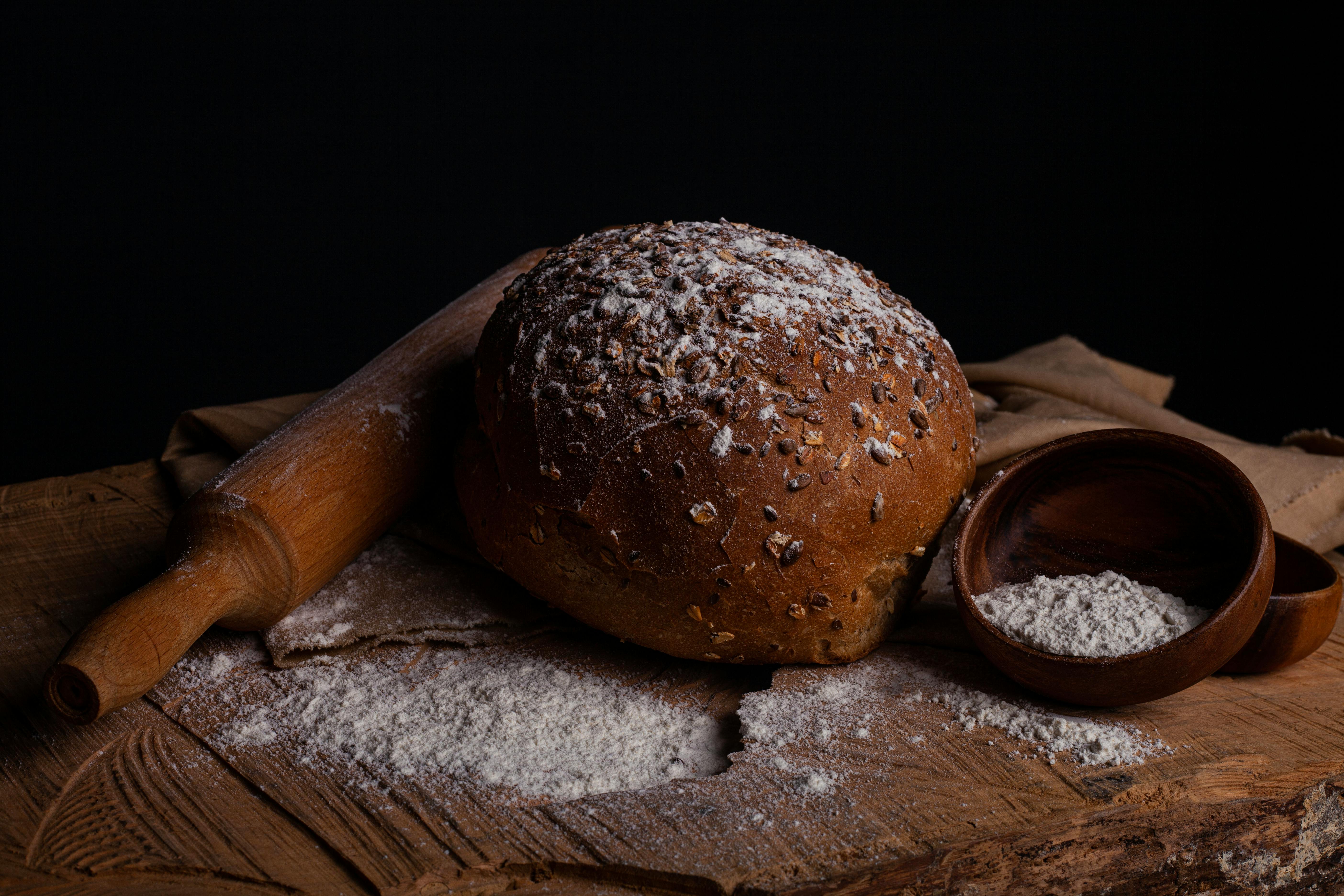 Sourdough bread slicing Stock Photo by grafvision