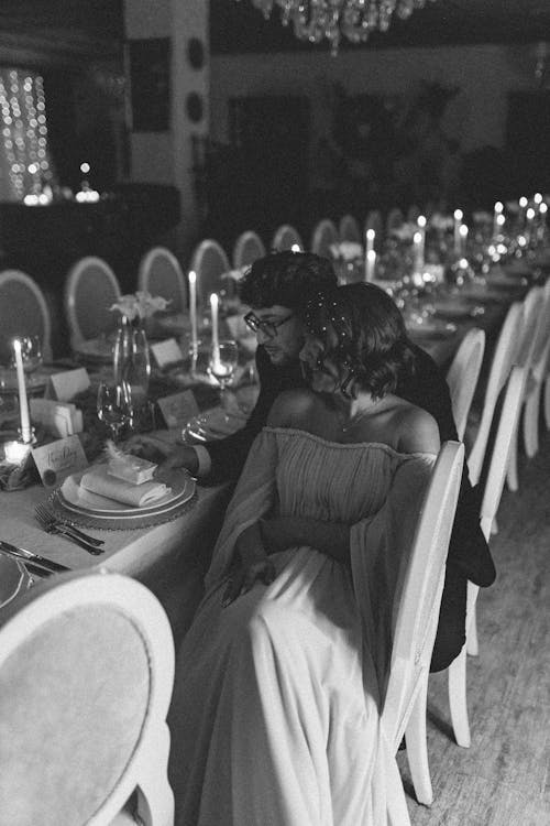 Bride and Groom Sitting Together at Table