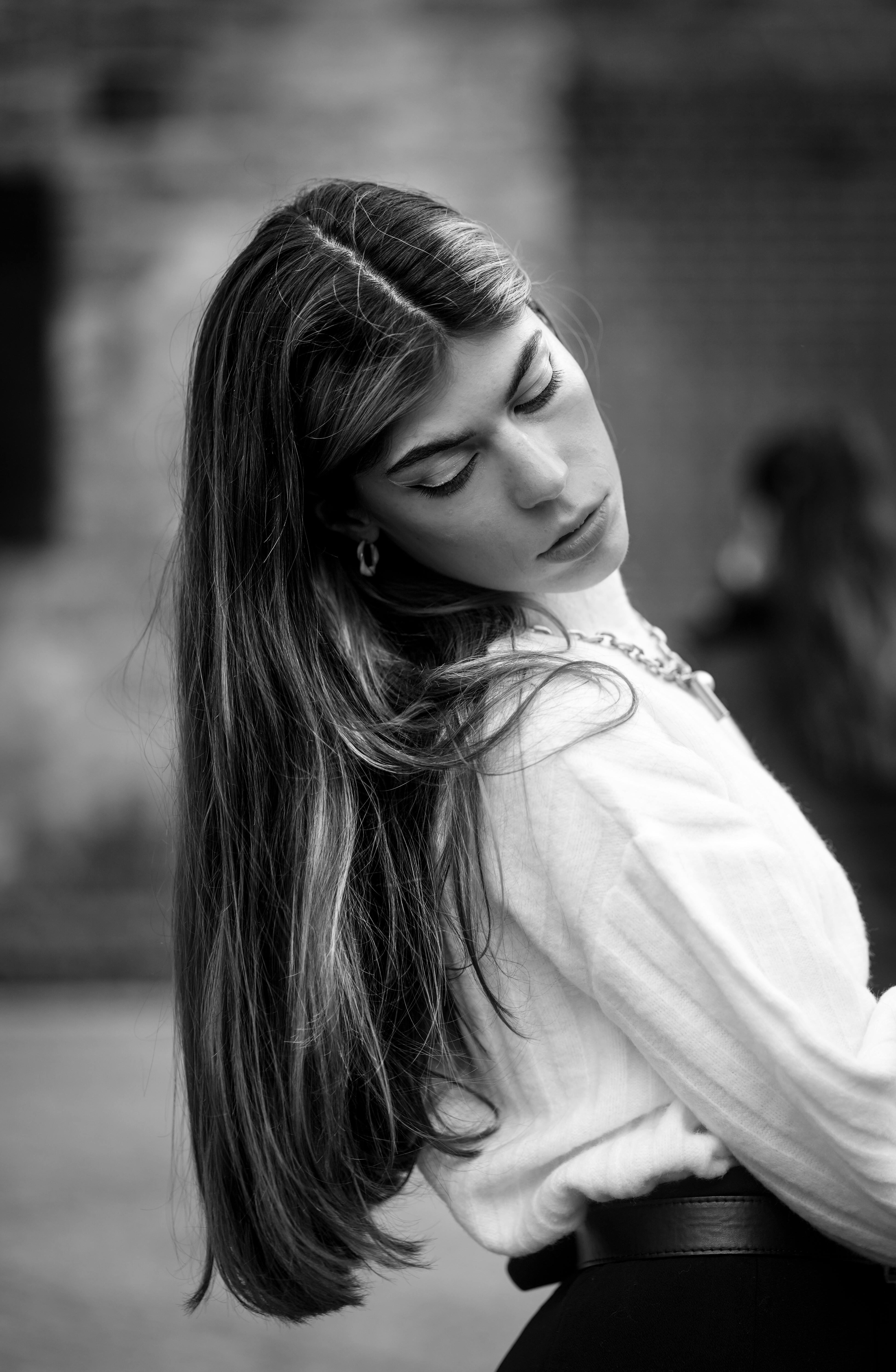 Beautiful Woman in White Blouse Looking Down · Free Stock Photo