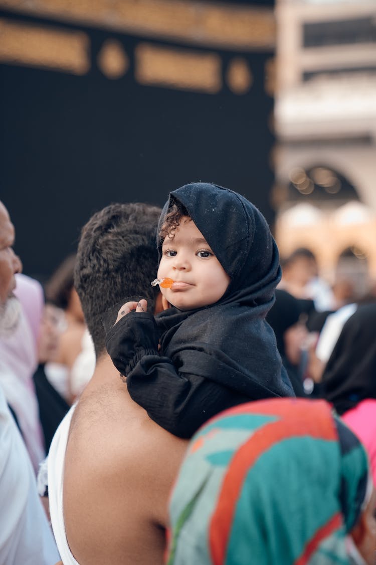 Little Girl On Man Shoulder