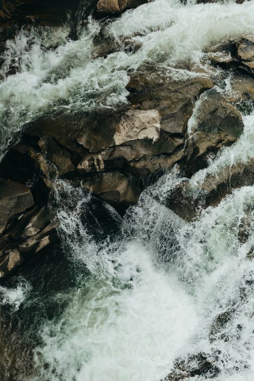 Free Dynamic and powerful river rapids flow over rocks in Yaremche, Ukraine. Stock Photo