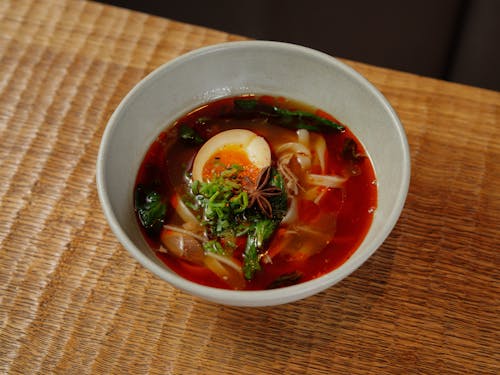 Delicious Soup with Egg in Bowl