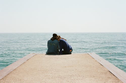 Young Couple on Pier in Sea