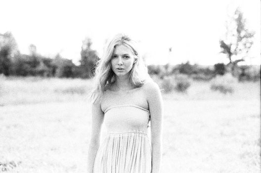 Blonde Wearing Strapless Dress in Countryside