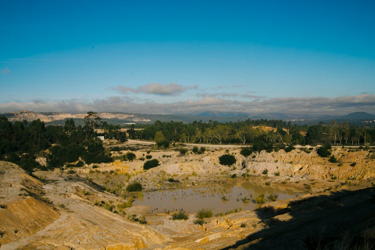 Landscape With Abandoned Quarry Filled With Water