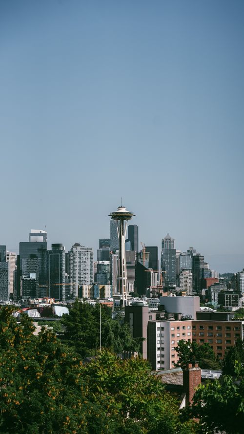 Free Stunning cityscape of Seattle, featuring the Space Needle amidst skyscrapers on a clear day. Stock Photo