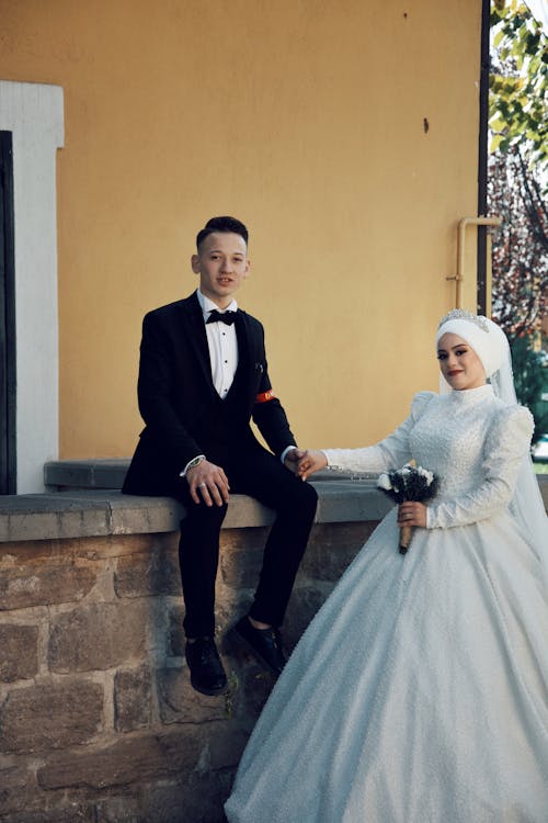 Bride and Groom Posing Outside and Smiling 