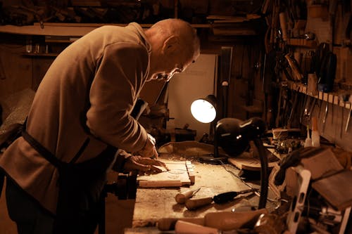 Elderly Artisan Working in a Workshop 