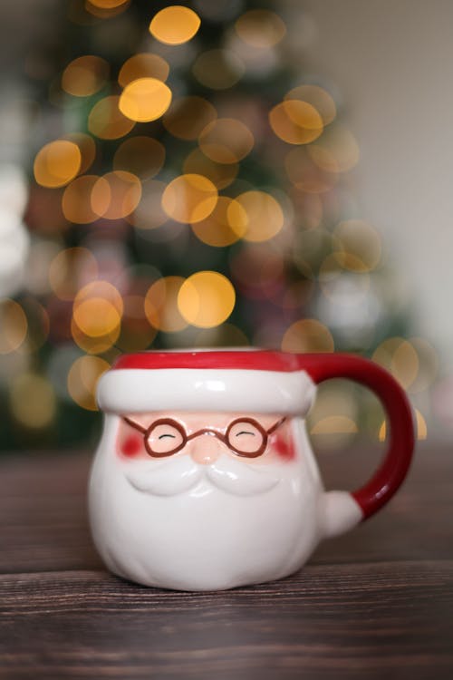 Mug in Shape of Santa Claus Head on a Table
