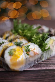 Close-up of fresh sushi rolls with vibrant vegetables and rice, perfect for Japanese cuisine lovers.