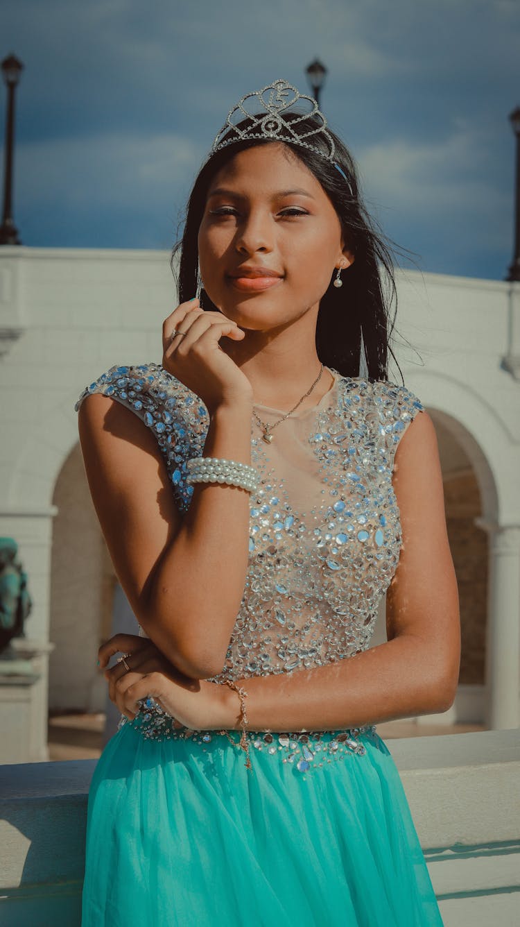 Young Girl Wearing An Elegant Dress And A Tiara 