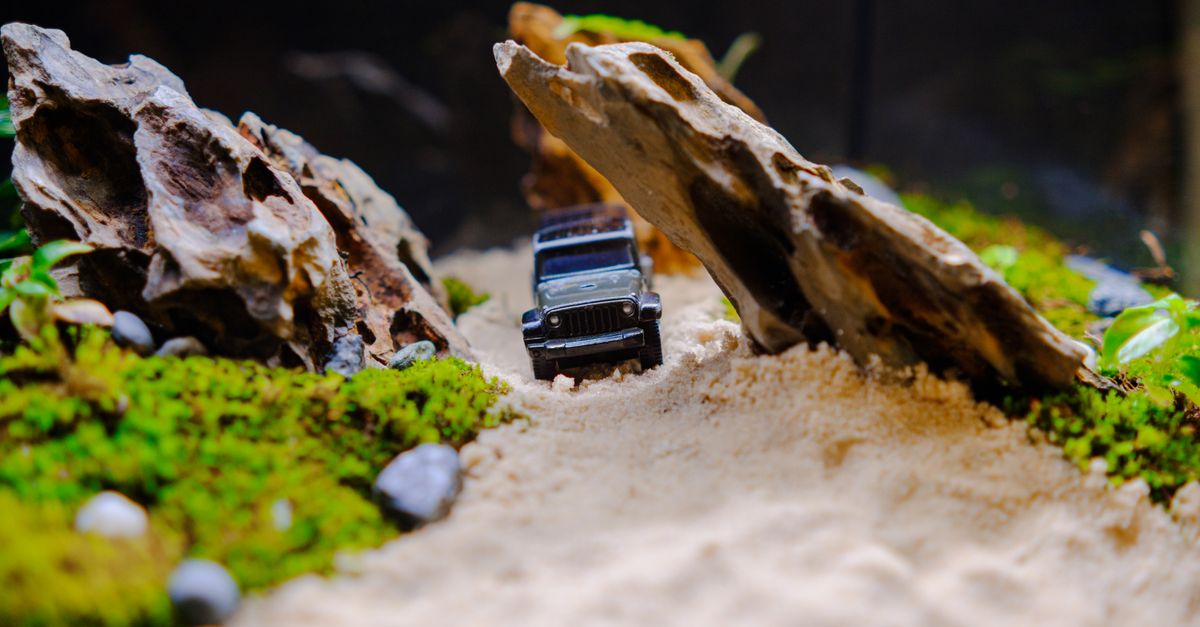 Cable Cars Between Rocks Miniature Car Between Rocks in a Diorama · Free Stock Photo