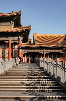The Forbidden City's grand architecture and intricate details under a clear sky.
