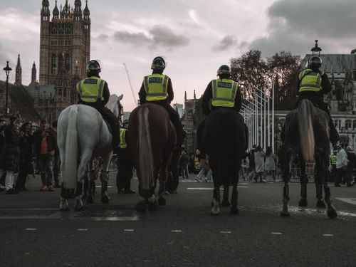Free Mounted police officers patrol near the British Parliament in London, United Kingdom. Stock Photo