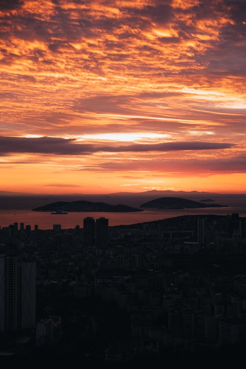 Foto profissional grátis de à beira-mar, alvorecer, cair da noite