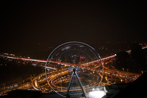 Ferris Wheel near Highway at Night