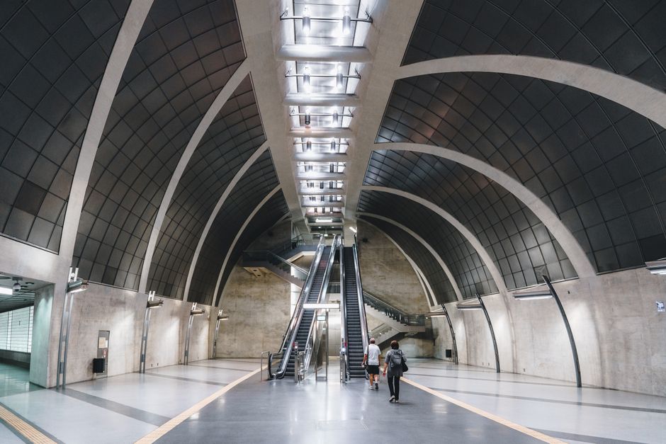 Modern Sofia Metro station in Bulgaria with a train arriving.
