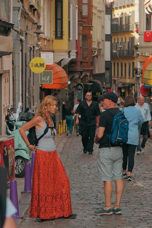 Blonde with Backpack Wearing Long Red Skirt 