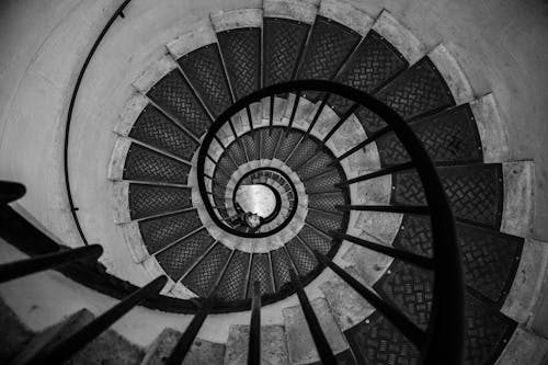 Man at Spiral Staircase in Black and White