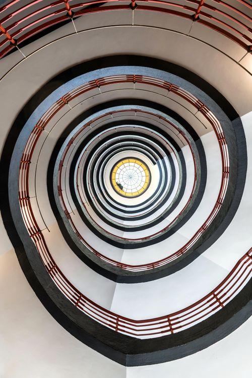 Free Intricate spiral staircase with a central glass ceiling in Hamburg, Germany. Stock Photo