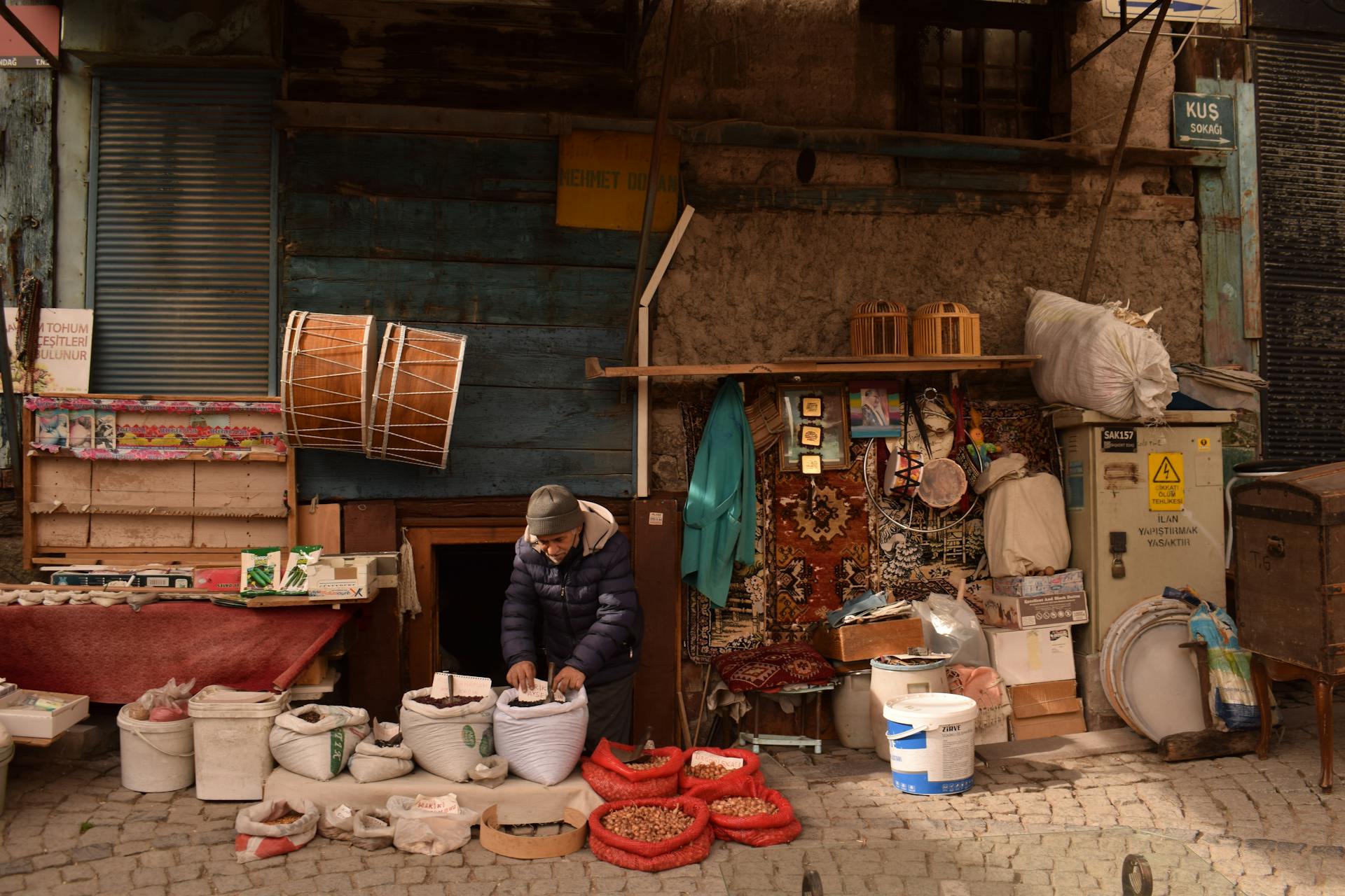 Elderly Trader Setting Up His Street Stall